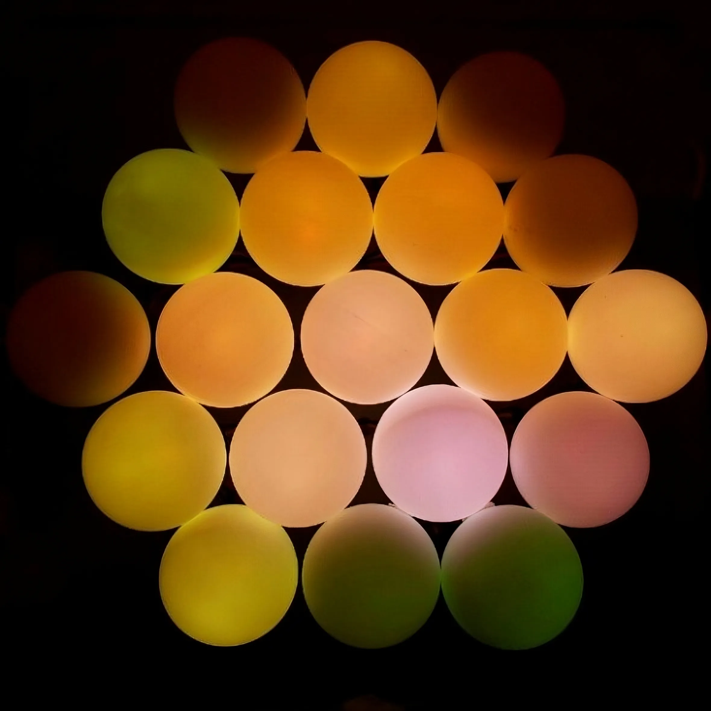 A matrix of coloured LEDs in a hexagon