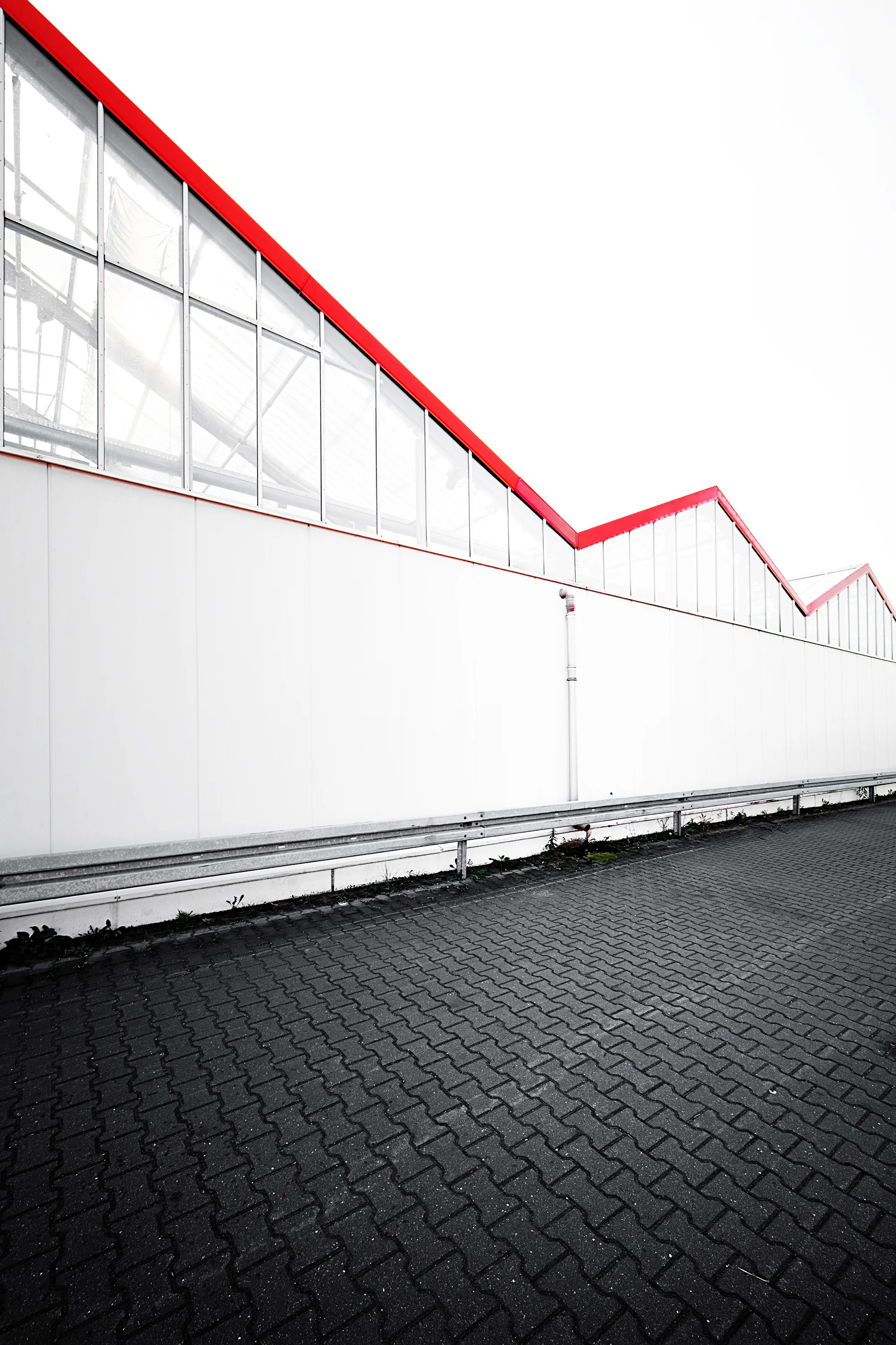 Picture of warehouse roofs that look like a downward line chart