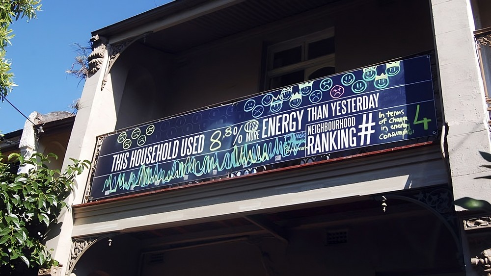 Terrace house with blackboard showing energy consumption and ranking