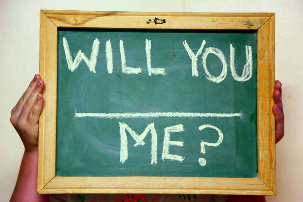 Chalkboard with the phrase 'will you (blank) me?'
